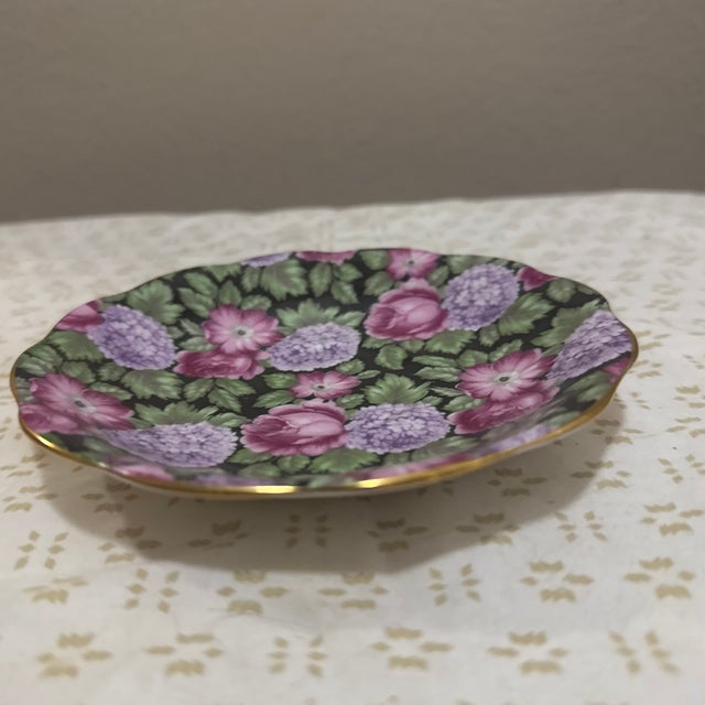 Charming and delicately detailed, this Royal Standard bone china saucer features a romantic pink rose and hydrangea motif...