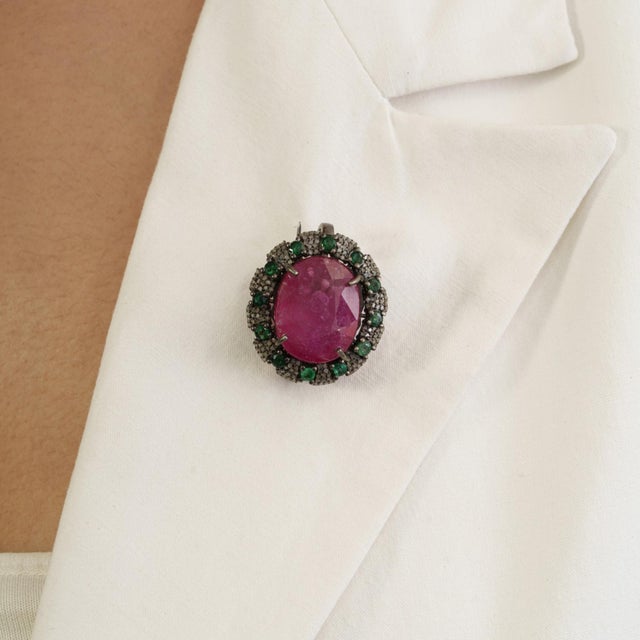Designer 14.6 Ct Oval Ruby, Emerald & Diamond Ornate Medallion Brooch Pendant makes a bold impression with a 12-carat...