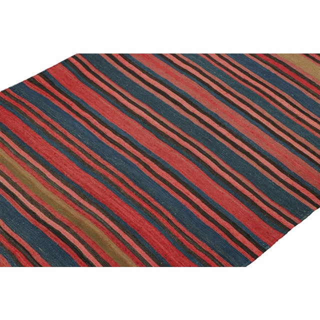 Handwoven in wool circa 1950-1960, this 4'8''x6' vintage Persian kilim is believed to be a tribal rug of Bidjar...