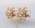 1950s textured goldtone flower with center section with round clear rhinestones clip earrings. Marked "PENNINO" on the...