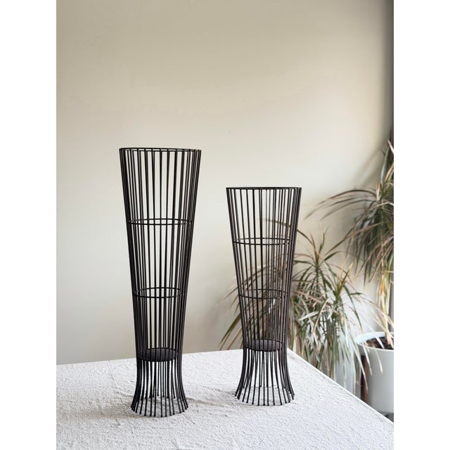 Vintage pair of black wire plant stands with great sculptural shape and clean atomic modern lines. Reminiscent of Arthur...