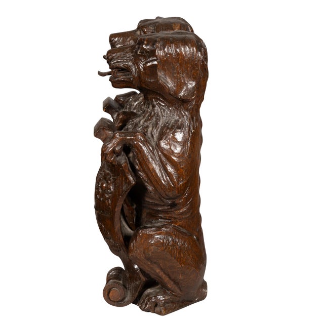 Carved Oak Figures Of Seated Dogs With Shields - a Pair | Chairish