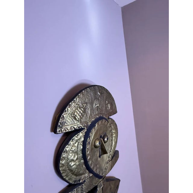 Evoking the enigmatic guardians of Gabon's ancient rituals, this Kota reliquary figure stands as a sentinel of ancestral...