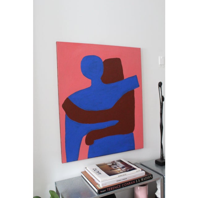This minimalist depiction of an embracing couple has been reimagined with a striking contrast between deep blue and rich...