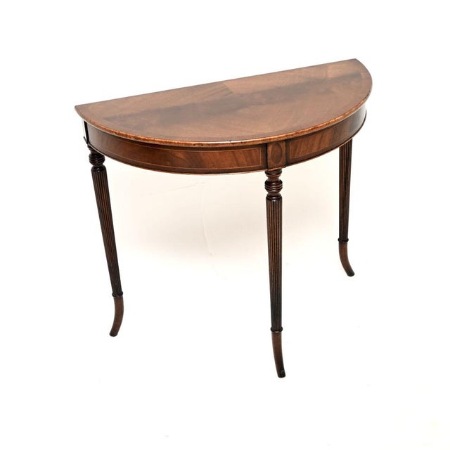 A beautiful and elegant antique Regency style console table. This was made in England, it dates from around the 1950’s....