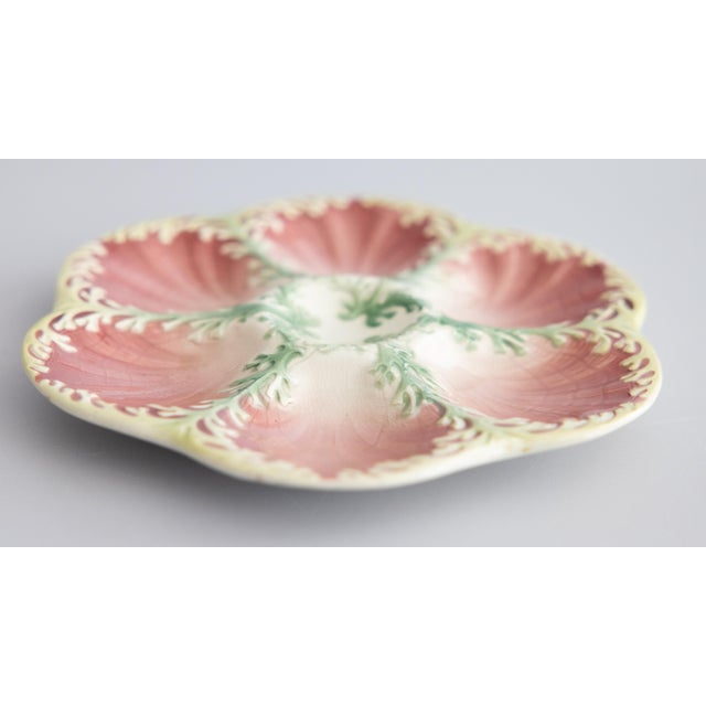 A lovely antique French Keller & Guerin Luneville majolica pink and green seaweed oyster plate, circa 1890. Maker's mark...