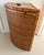 Vintage tortoise rattan corner laundry basket that features a hinged lid and a space saving triangular design