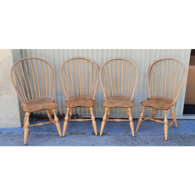 20thc Bow Back Windsors set of four matching set. 20th century bow Back Windsor chair signed on the base by the maker....