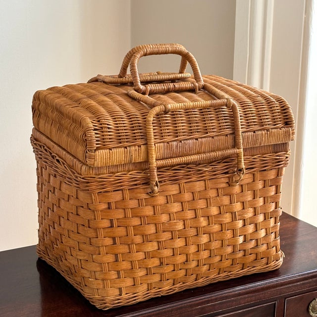 A beautifully handcrafted vintage utility basket woven from honey-toned rattan and wicker with exceptional attention to...