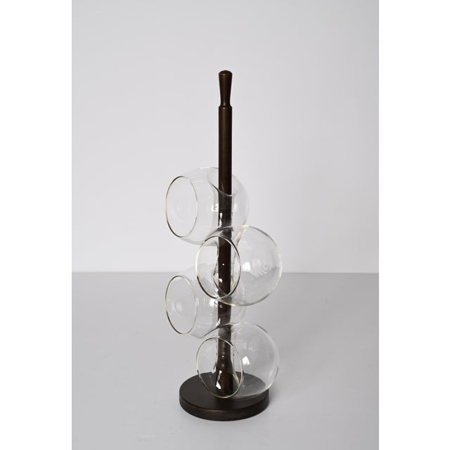 Excellent midcentury blown drinking glasses and walnut wood holder set. This fantastic set was produced in Italy during...