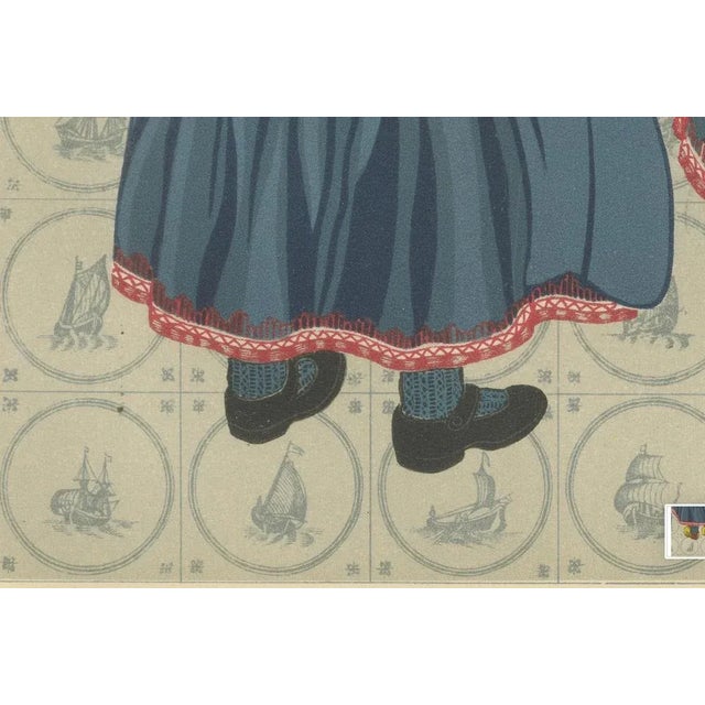 Traditional Dutch Costume from Marken – Men and Children in Festive Dress This vibrant and richly detailed print portrays...