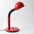 Red desk lamp from Electra. It was made in the 1980s/90s in Poland. It has a goose-neck adjustable arm. It uses one E27...