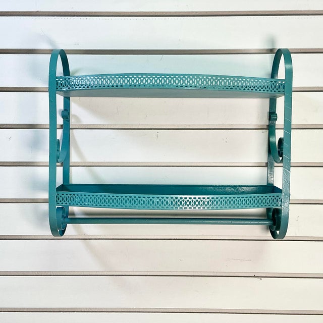 A wonderful storage find. This Mid-Century metal wall-mounted shelf was crafted for the bathroom, but can be used anywhere...