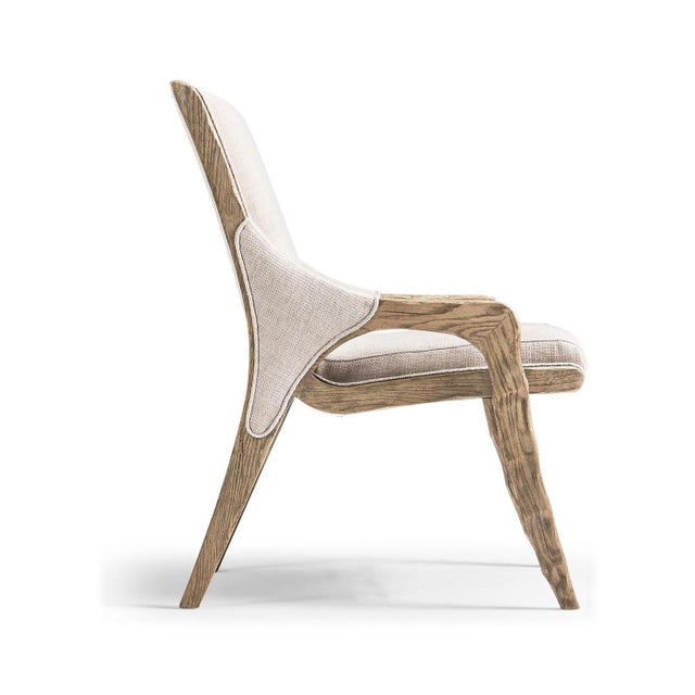 Side Chair embodies a refined balance of traditional craftsmanship and contemporary restraint, pairing a sculpted solid...