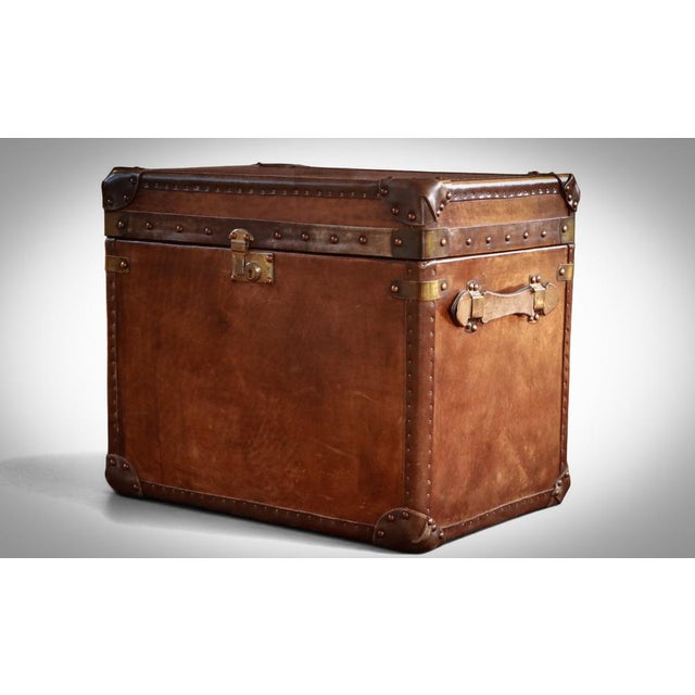 Up for grabs here is a stunning quintessential English officer's military campaign style Trunk sidetable. Made to an...