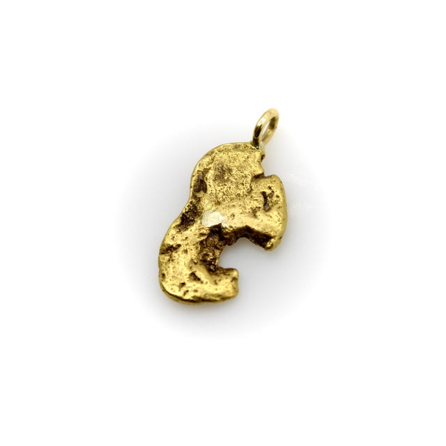 Whenever we can, we try to acquire gold nugget jewelry, as we love the free form nature of the gold. This one has an...
