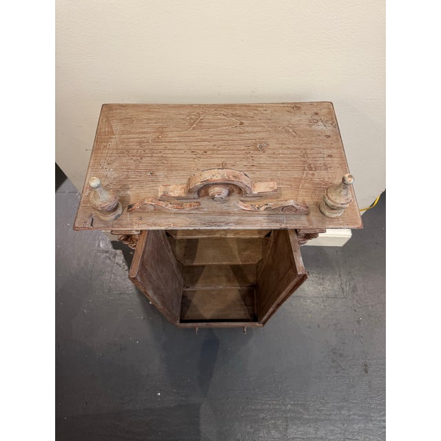 This is a miniature scandinavian cupboard. It is rennaissance style. It has three shelves and one drawer for storage. It...