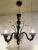 Classical black and gold murano glass chandelier with flowers and leaves. traditional piece of italian art of blowing...