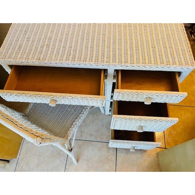 Charming white wicker and wood vintage desk and chair set. Desk is sturdy and in good condition consistent with age and...