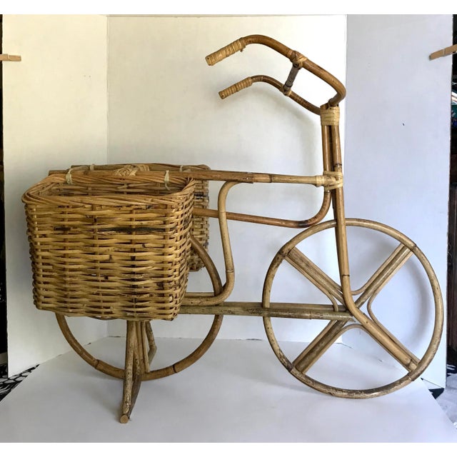 This is such a charming piece from the mid-century of a bicycle that is made of woven wicker rattan with a bamboo frame. I...