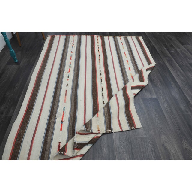 Vintage Hand-Knotted area rug is a semi-antique vintage area rug. The '70s Eastern region of Anatolia's unique rug is...