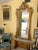 Pair of Napoleon III giltwood pier mirrors circa third quarter 19th Century. The arched rectangular beveled mirrors within...