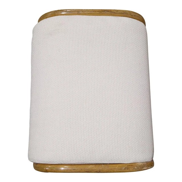 Pair of bamboo and rattan stools, padded fabric cushions. Dimensions (wxdxh) 64 x 50 x 45 cm