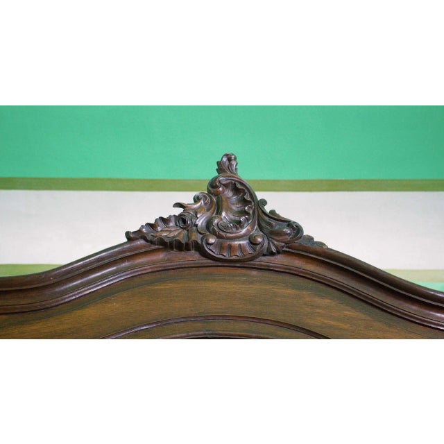 Wardrobe made of solid oak carved in the style of Louis XV with faceted mirrors. Three-door design, where the central door...