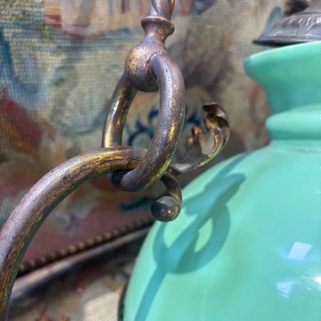 Antique Art Nouveau chandelier from 1920, bronze with foliage and typical elements of the period, green glass bell....