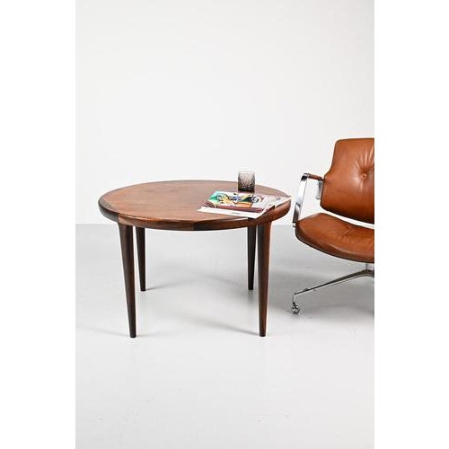W-Møbler coffee table from the Sixties and made from rosewood and rosewood veneer. Beautiful detail is the edge of the...