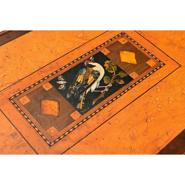 A wonderful birch side table from the 1800’s, the top features colorful marquetry & inlay designs of geometric patterns on...