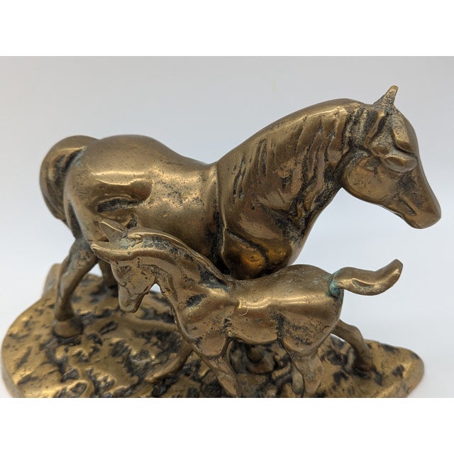 Lovely vintage brass statue of a mare and foal. Perfect for MCM or horse decor lovers. Would make a great mantel piece....