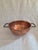 Beautiful Large Copper Pot from the late 1800s. Heavy copper with hand rolled top edge and steel handles. Many have argued...