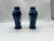 Chinese, likely late Qing Dynasty. A pair of porcelain urn or vases with a rich blue cobalt ground body accented by...