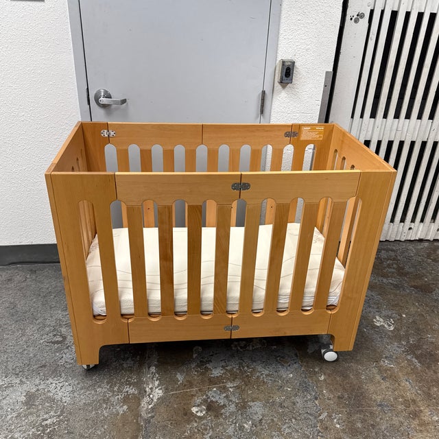 Design Plus Gallery presents the Alma Papa Folding Crib in Natural Beech Wood from Bloom. This contemporary crib showcases...