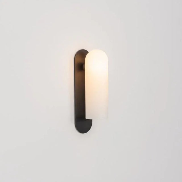 Odyssey lg black wall sconce by schwung dimensions: w 10.5 x d 14 x h 38 cm materials: black gunmetal, frosted glass...