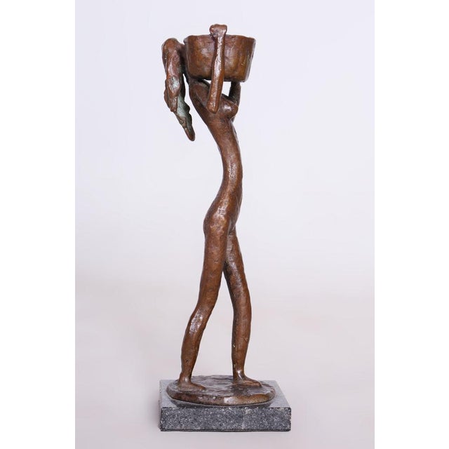 This charming figurine of a girl with a bucket is an authentic representative of Art Deco decorative art. It dates back to...