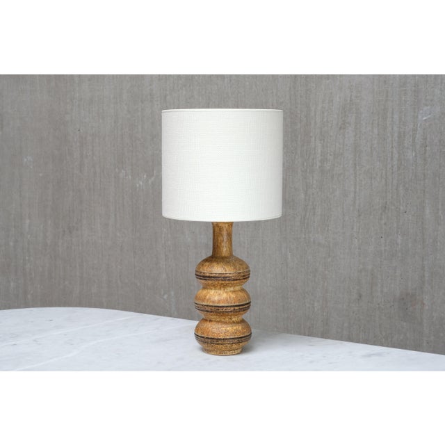 This rare table lamp was designed by Jette Hellerøe and produced by Axella Keramik in Denmark in the 1970s. The base is...