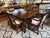 Design Plus Gallery presents a Near Vintage Empire Style Dining Room Table + Six Chairs from Hickory Chair Company. The...