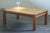 This solid pine wood table from the 1970s/80s reflects the Nordic elegance of Knud Friis & Elmar Moltke’s style. Crafted...