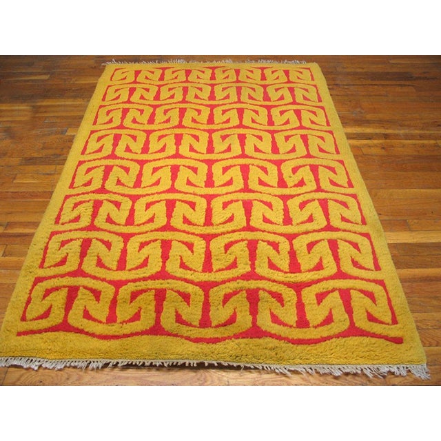 Mid 20th Century Spanish Art Moderne Carpet ( 4' x 6'2" - 122 x 188 ) A yellow and salmon-red reciprocal curved arrowhead...