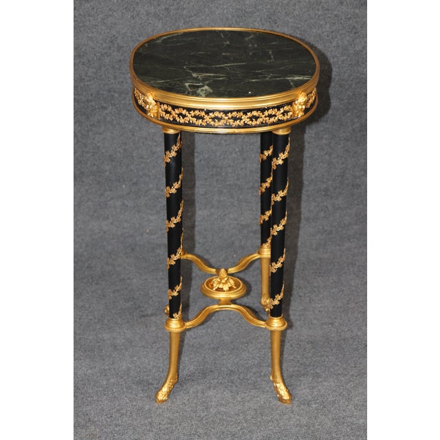 This exceptionally elegant Louis XVI-style occasional table, in the manner of Adam Weisweiler, combines the restrained...