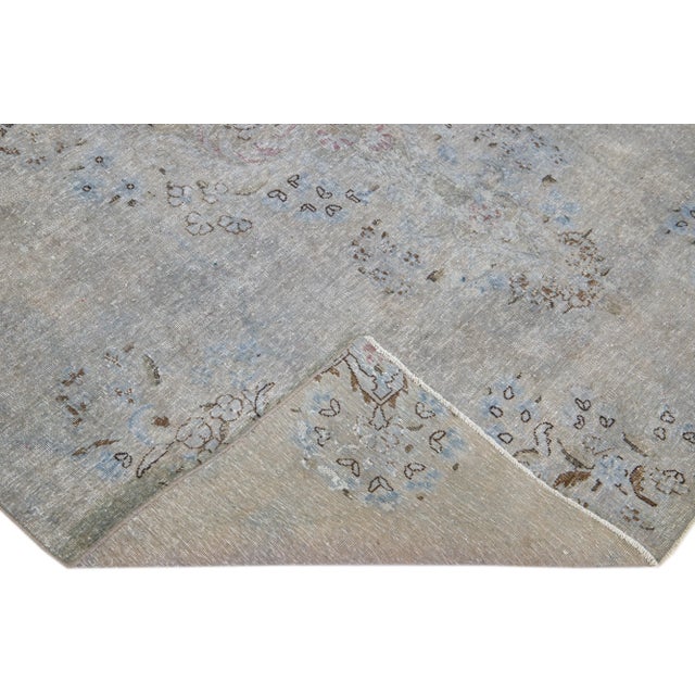 Beautiful Vintage Overdyed hand-knotted wool rug with a gray field. This Persian rug has multicolor accents in an all-over...