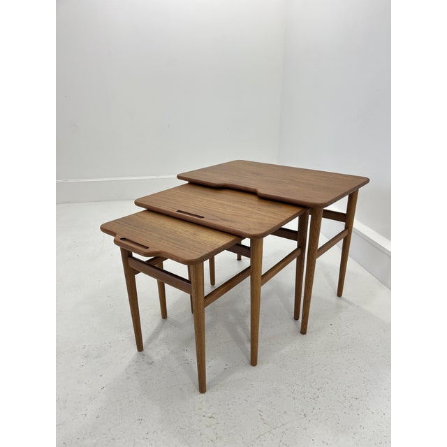 This fine set of 3 nesting tables was designed by Kurt Østervig for Jason Møbler. These high-quality pieces are made from...