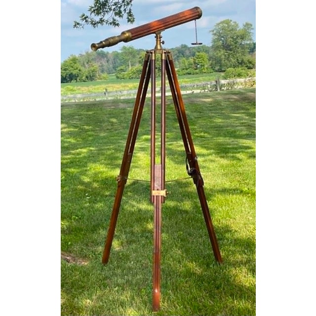 Stunning Vintage telescope with beautiful patina. The eyepiece, focusing shaft, lens, and mounting apparatus are brass...
