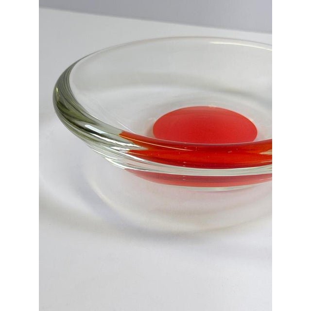 A striking Murano sommerso glass bowl produced in Italy during the 1970s, combining exceptional clarity with bold colour...