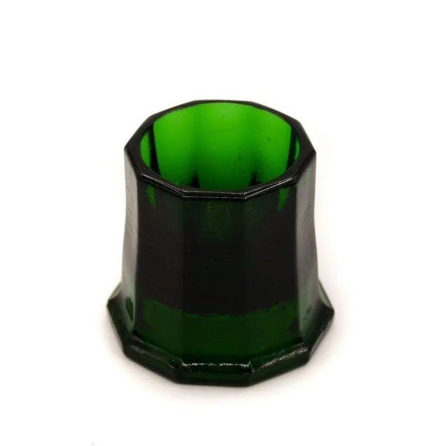 Pressed glass egg cup is a fanciful decorative object designed by Karel de Bazel for Leerdam Glass factory in 1920s....