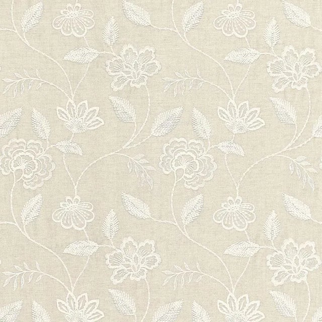 Penelope Embroidery features a trailing bloom and vine motif in an ivory yarn on a herringbone cotton-linen ground. Subtle...