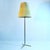 Elegant Kalmar floor lamp, Vienna circa 1950's has an aerodynamic cast brass tripod foot, patinated brass stem and large...