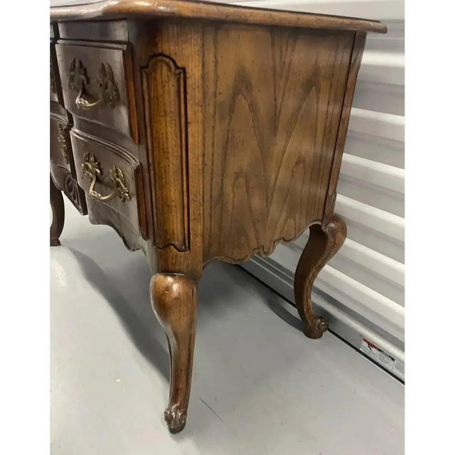 Offered is a vintage solid wood French provincial style chest that can be used as a nightstand, hall chest, etc by Baker...